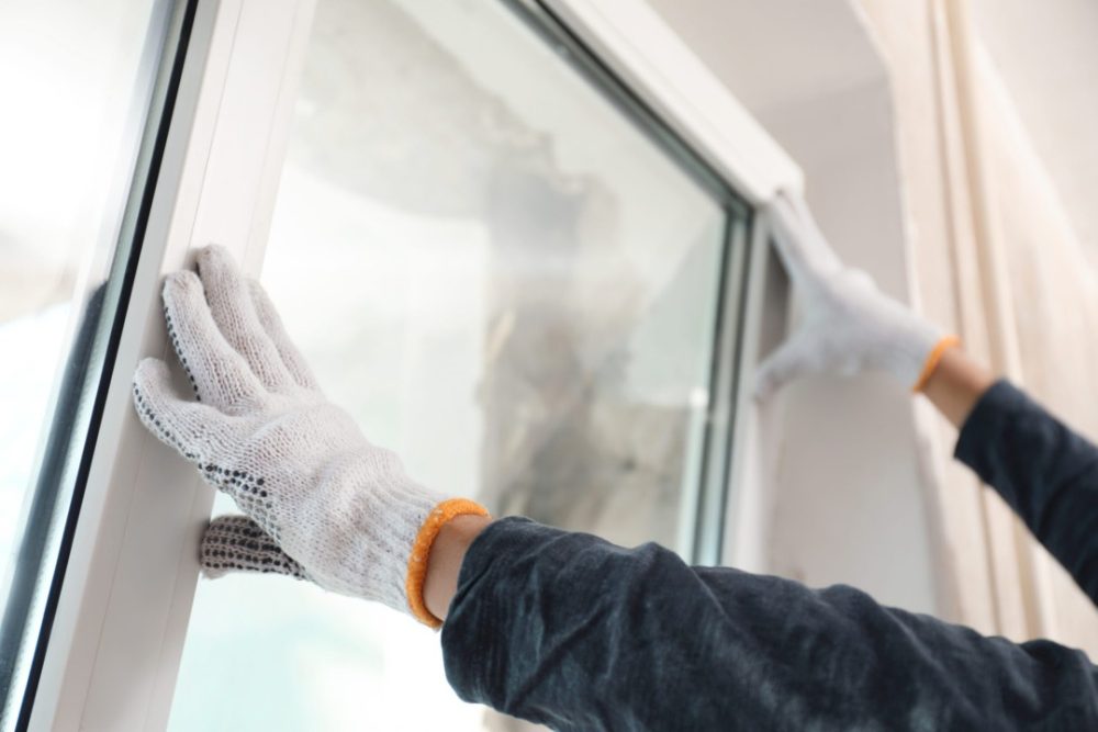 Window repair completed by a construction worker. 